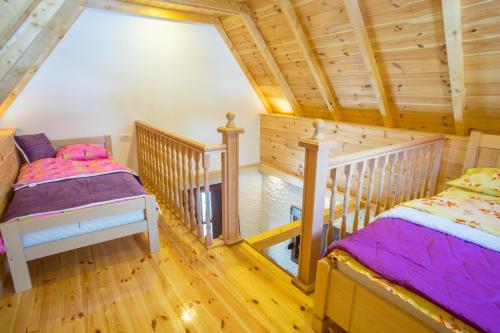 A bed or beds in a room at Koliba Činčila