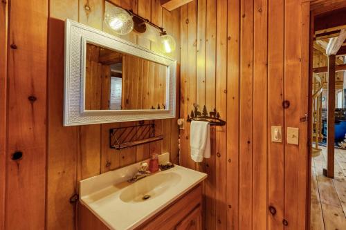 a bathroom with a sink and a mirror at Camp Foxtrot in Greenville