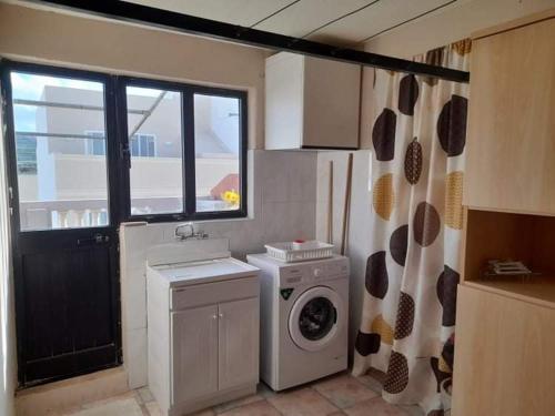 Kuchyň nebo kuchyňský kout v ubytování Flat 3
