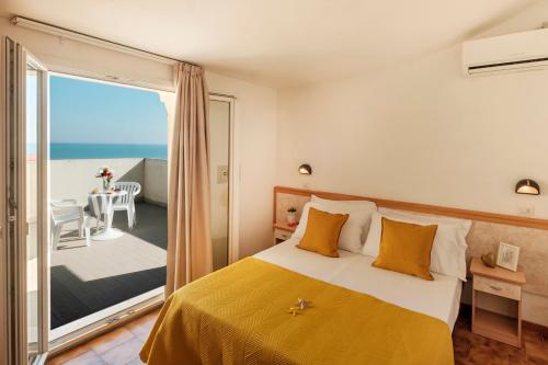 Postel nebo postele na pokoji v ubytování Hotel Oceanic