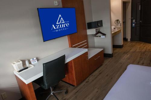 a office with a desk and a sign on the wall at The Azure Hotel in Mesa