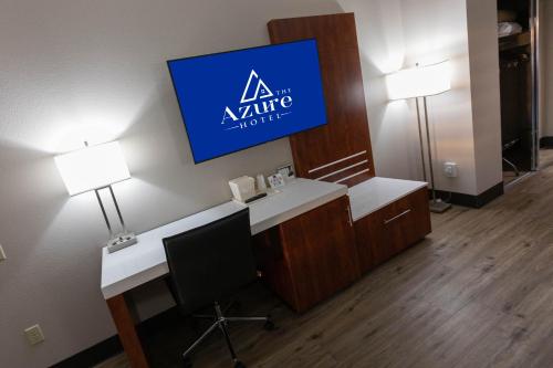 a office with a desk and a sign on the wall at The Azure Hotel in Mesa