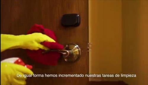 a parrot is unlocking a door with a handle at Hotel del Gobernador in Mérida