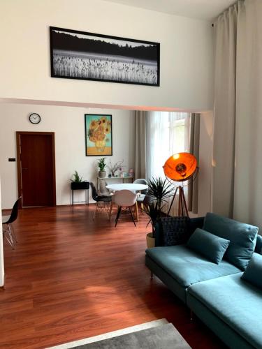 a living room with a couch and a table at Historická vila Dom hostí in Podbrezová