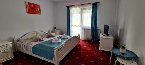 Un pat sau paturi într-o cameră la Vila Sofia
