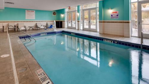 a large swimming pool with blue water at Best Western Premier I-95 Savannah Airport/ Pooler West in Savannah