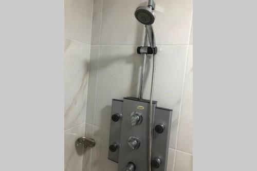 a shower with a blow dryer in a bathroom at (5)Modern Miraflores tourist area apartment in Lima