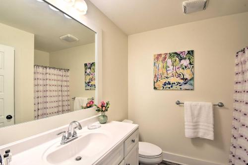 a bathroom with a sink and a mirror at 1 Mi to Town Chalet-Style Highlands Retreat in Highlands