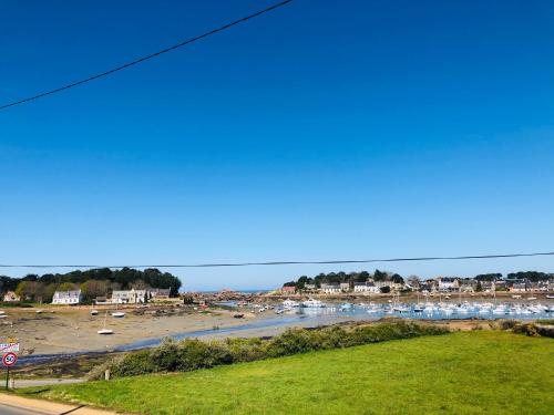 a view of a harbor with boats in the water at L'Albatros in Perros-Guirec