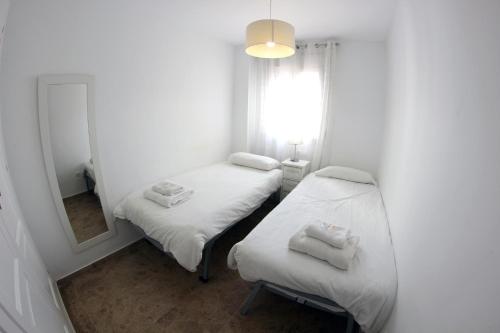 Postel nebo postele na pokoji v ubytování Puerto Blanco