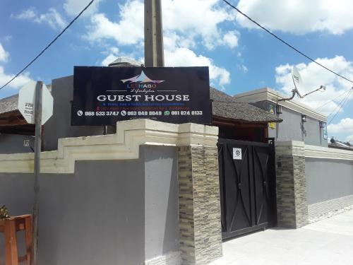 a guest house sign on the side of a building at Lethabo Guest House in Elandsfontein