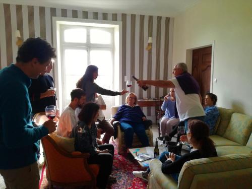 a group of people in a living room playing a video game at Château MontPlaisir charming b&b in Provence in Valréas