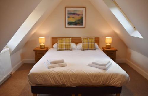 Katil atau katil-katil dalam bilik di Osprey Cottage, Port o Tay