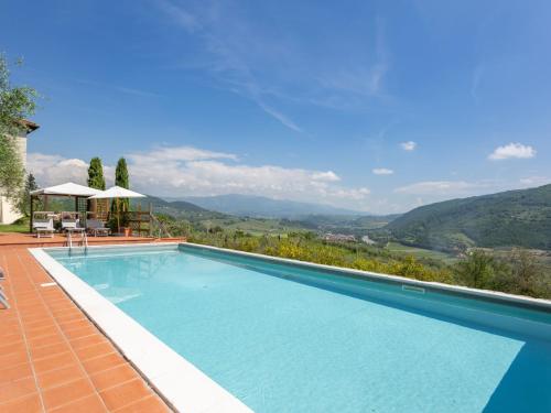 a swimming pool with a view of the mountains at Villa Villa Monteloro by Interhome in Ellera