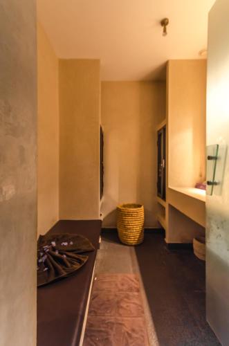 a kitchen with a stainless steel refrigerator in a room at Dar Sabra in Marrakech