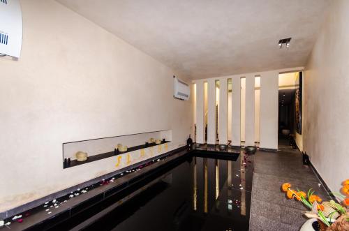 an indoor bowling alley with a pool of water at Dar Sabra in Marrakech