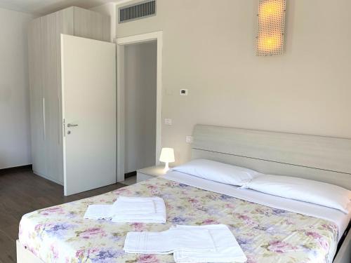 Ένα ή περισσότερα κρεβάτια σε δωμάτιο στο Camere e case vacanza Residenza Prealba