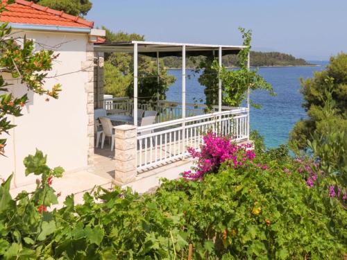a house with a view of the water at Holiday Home Bernardi by Interhome in Lumbarda