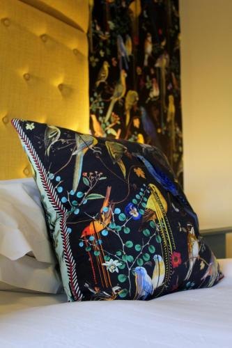 a pillow sitting on top of a bed at 24 Royal Terrace in Edinburgh