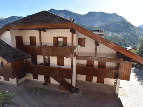 a model of a house with mountains in the background at Apartment Villaggio Ladino by Interhome in Mazzin