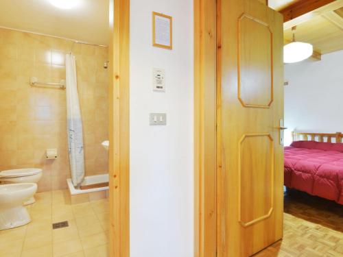 a bathroom with a toilet and a shower at Apartment Villaggio Ladino by Interhome in Mazzin