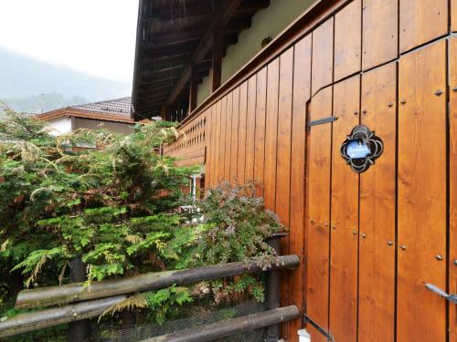 a fence with a gate with a wreath on it at Apartment Villaggio Ladino by Interhome in Mazzin