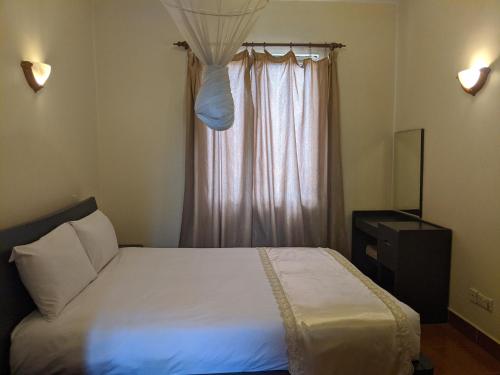 Ένα ή περισσότερα κρεβάτια σε δωμάτιο στο Prestige Hotel Suites