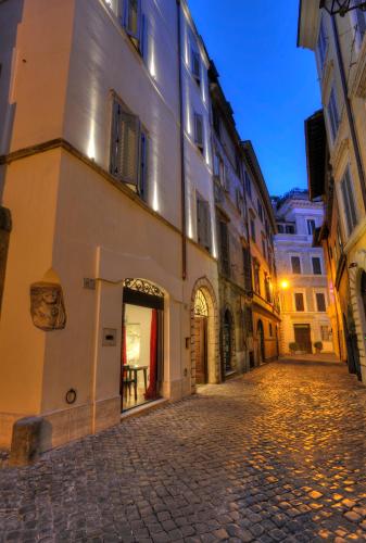 an empty street in a city at night at Relais Orso in Rome