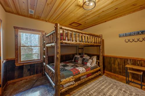 a bedroom with a bunk bed in a cabin at The Nest in Blue Ridge