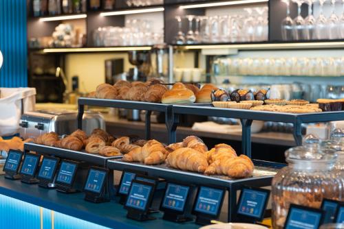 a bunch of pastries on display in a bakery at Modica Boutique Hotel in Modica