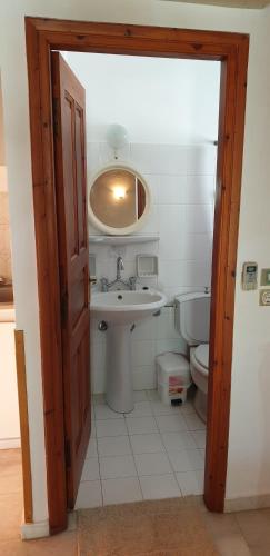 a bathroom with a sink and a toilet at EVI Studios & Apartments in Naxos Chora