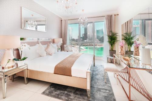 a bedroom with a bed and a view of the city at Elite Royal Apartment - Full Burj Khalifa & Fountain View - Brilliant - 2 bedrooms & 1 open bedroom without partition in Dubai