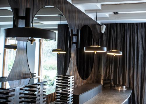a tasting room with a bunch of wine racks at Hotel Natura Residence Business&SPA in Siewierz