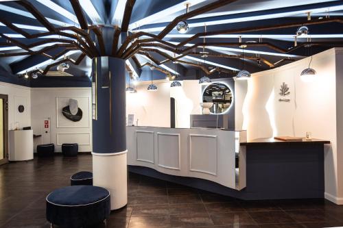 a large room with a ceiling with a blue at Hotel Natura Residence Business&SPA in Siewierz