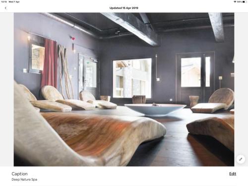 a room with two chairs and a tub in it at Arc 1950 Ski in Ski out and Spa- Newly refurbished 153 Sources De Marie- 2 bedroom , 2 bathroom-Sleeps 4-6, Mont Blanc view from every window, Free WiFi in Arc 1950