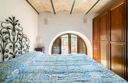 Een bed of bedden in een kamer bij Borghetto San Pio V