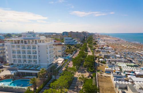 an aerial view of a beach with buildings and the ocean at Hotel Ambasciatori in Riccione