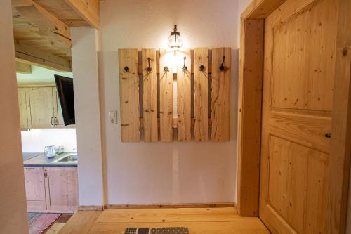 a room with a door and a chandelier on the wall at Familienwanderhof Eggeler in Liesing