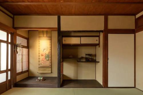 a room with a bunk bed in the corner at Yamagata Kyomachihatago Kyotostation Mae in Kyoto