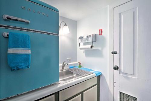 a bathroom with a sink and a blue wall at Charming Getaway Less Than 1 Mi to Downtown Lambertville! in Lambertville