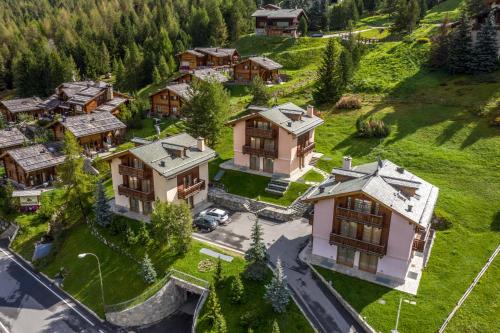 an aerial view of a house in a mountain at Chalet Teola in Livigno