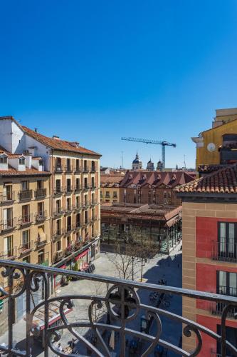 a view of a city from a balcony at Madrid 1915 Private Suites in Madrid