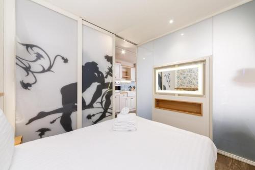 Ένα ή περισσότερα κρεβάτια σε δωμάτιο στο London Bridge Boutique by Viridian Apartments
