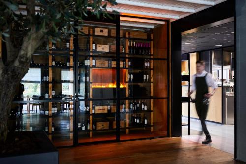 a man is walking into a wine tasting room at Kasteel Kerckebosch in Zeist