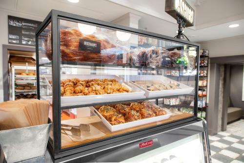 a display case in a store with various food items at Hotel La Rose in Santa Rosa