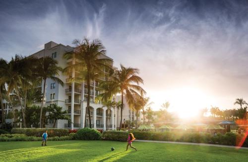 two people playing soccer in front of a hotel at Margaritaville Vacation Club - Rio Mar in Rio Grande