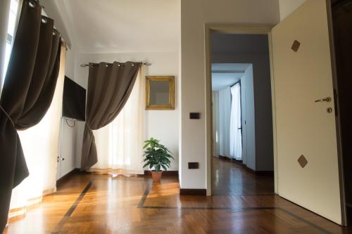 a hallway with curtains and a potted plant at Residenza Kastrum in Cagliari