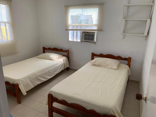 Un ou plusieurs lits dans un hébergement de l'établissement "Casa Viña Del Mar" Playa Blanca