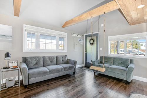a living room with a couch and a chair at Siletz Bay Getaway in Lincoln City