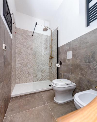 a bathroom with a toilet and a shower at L'Accademia dei Sogni in Sassari